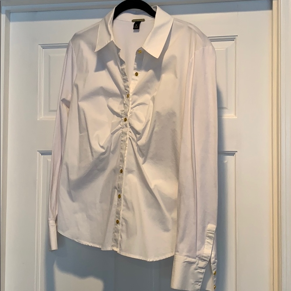 Button-down white top with gold buttons